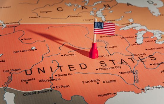 The united states flag on a map of the united states.